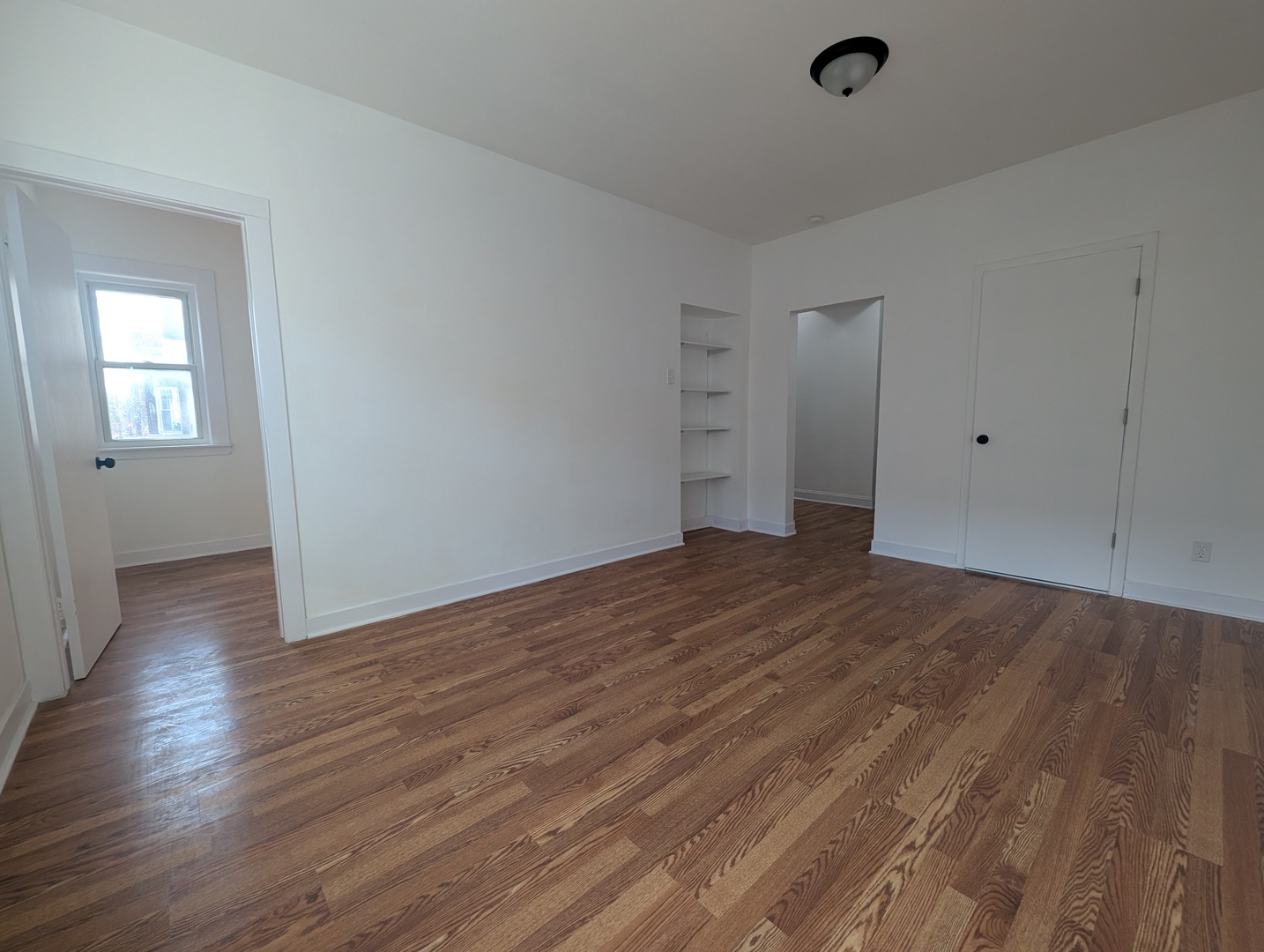 1520 West Melrose Street, Unit 2F Chicago, IL 60657 - Photo 3 of 16 wooden floor in an empty room