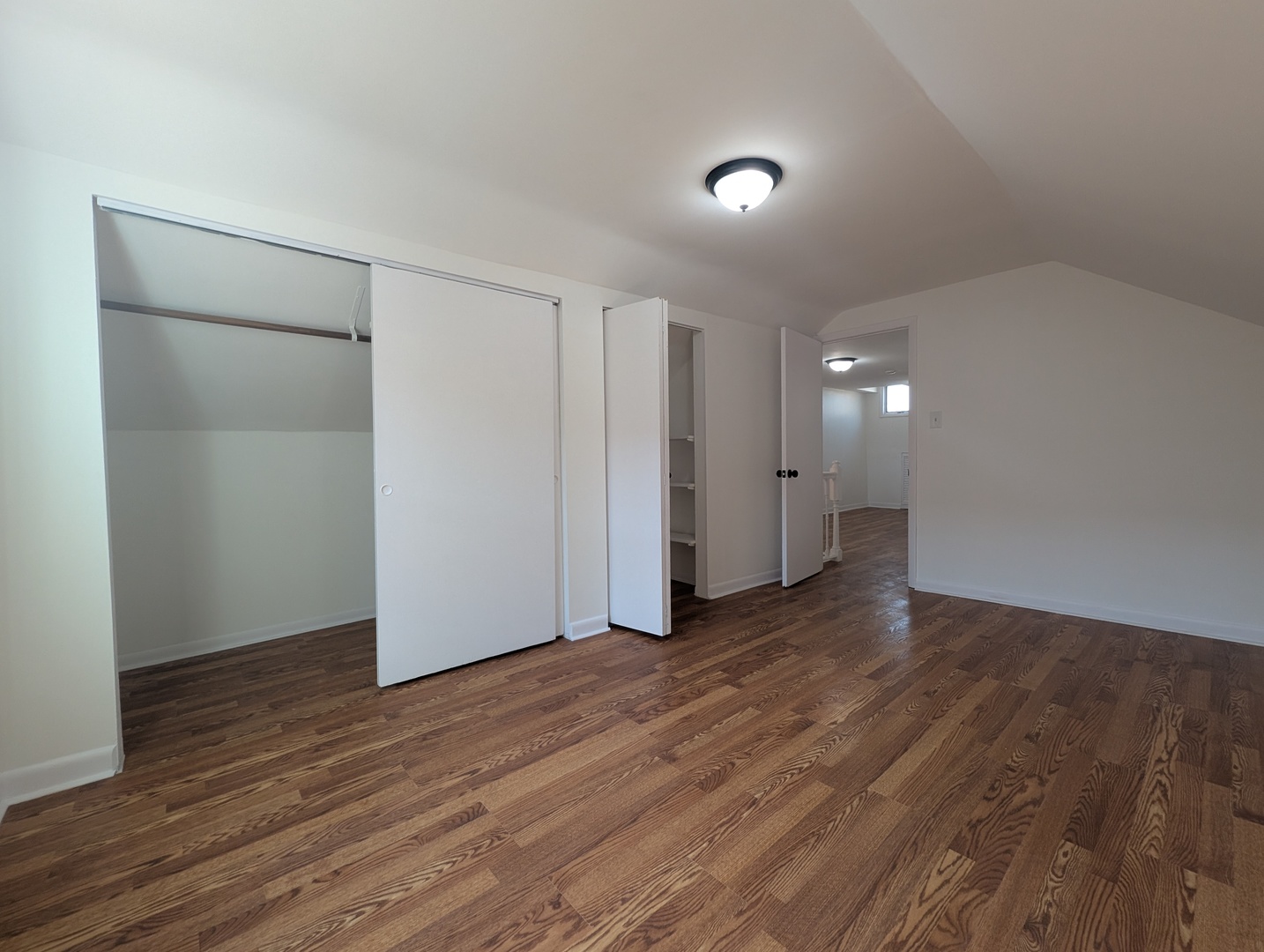 1520 West Melrose Street, Unit 2F Chicago, IL 60657 - Photo 6 of 16 a view of an empty room with wooden floor