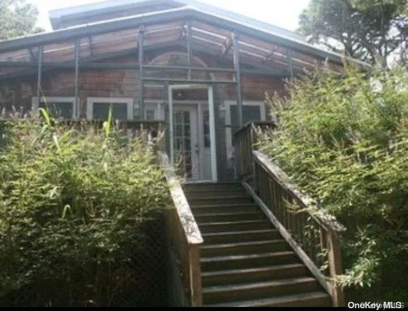 a view of a pathway of the house and front door