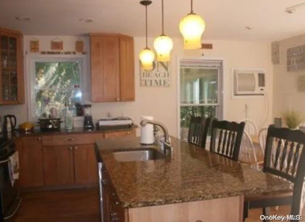 a kitchen with sink and window