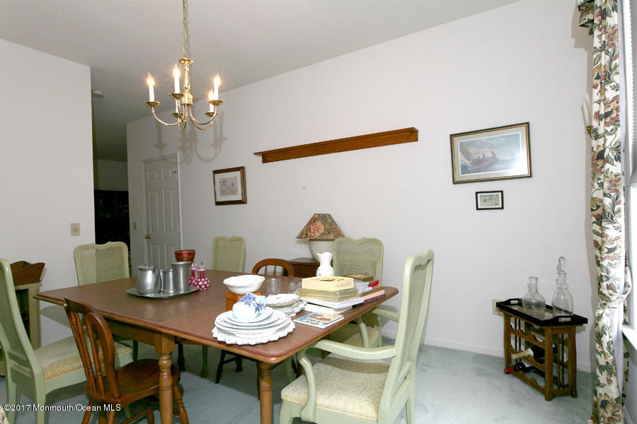 48 Quail Road Barnegat, NJ 08005 - Photo 19 of 19 a view of a dining room with furniture and chandelier