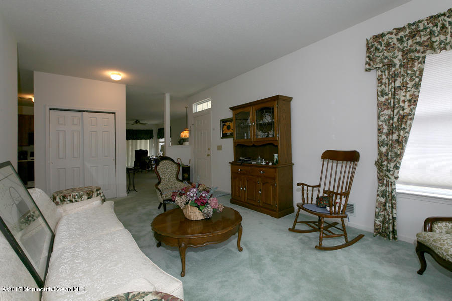 48 Quail Road Barnegat, NJ 08005 - Photo 5 of 19 a living room with furniture and a chandelier