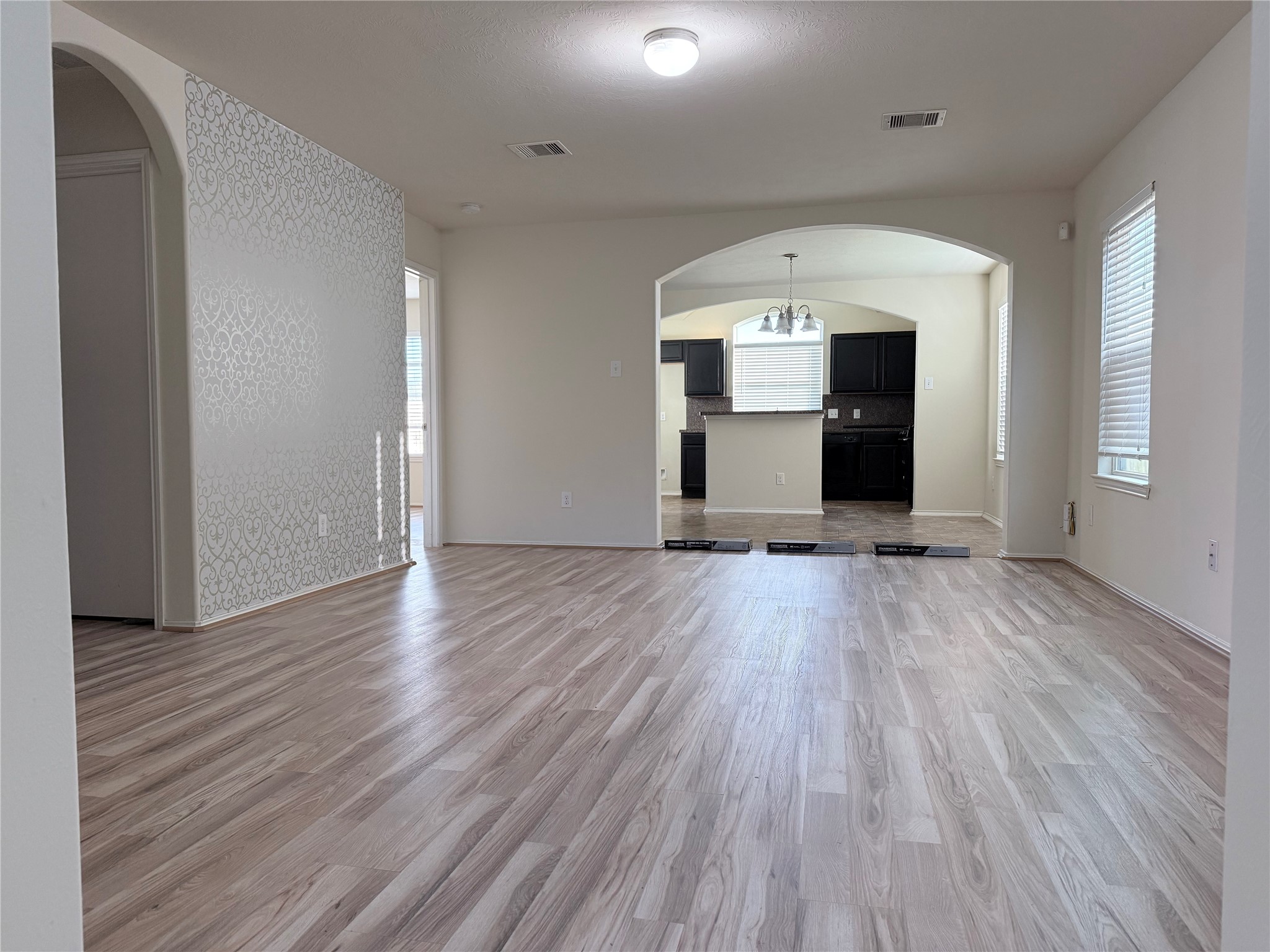 2819 Back Bay Brook Trail Houston, TX 77045 - Photo 1 of 16 an empty room with wooden floor and windows