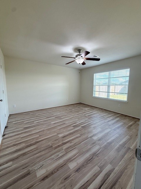 2819 Back Bay Brook Trail Houston, TX 77045 - Photo 11 of 16 wooden floor in an empty room with a window