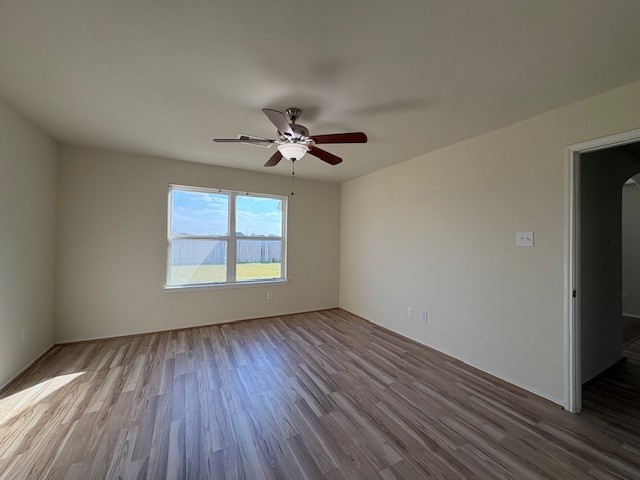 2819 Back Bay Brook Trail Houston, TX 77045 - Photo 6 of 16 wooden floor in an empty room with a window