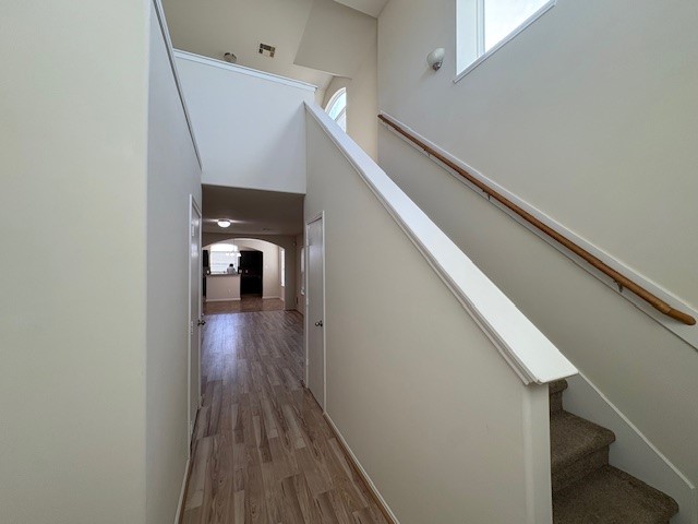2819 Back Bay Brook Trail Houston, TX 77045 - Photo 10 of 16 a view of a hallway with wooden floor and stairs
