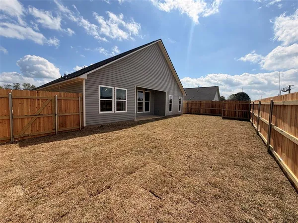 a view of backyard of house