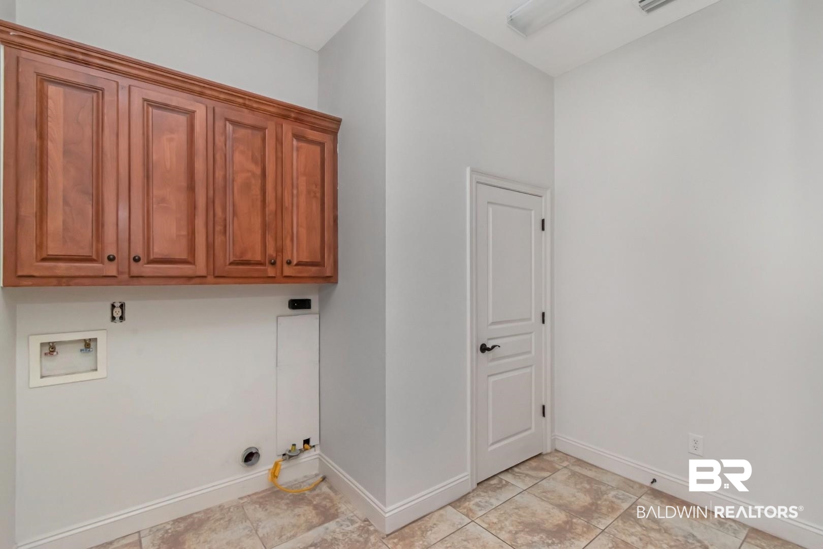 30585 Pine Court Daphne, AL 36527 - Photo 18 of 49 Laundry area with cabinet space and hookup for a washing machine