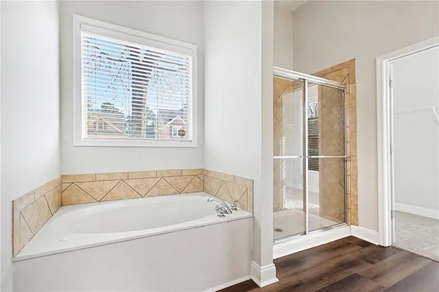 a white bath tub sitting next to a window