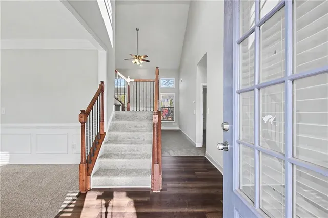 a view of entryway and hall with wooden floor