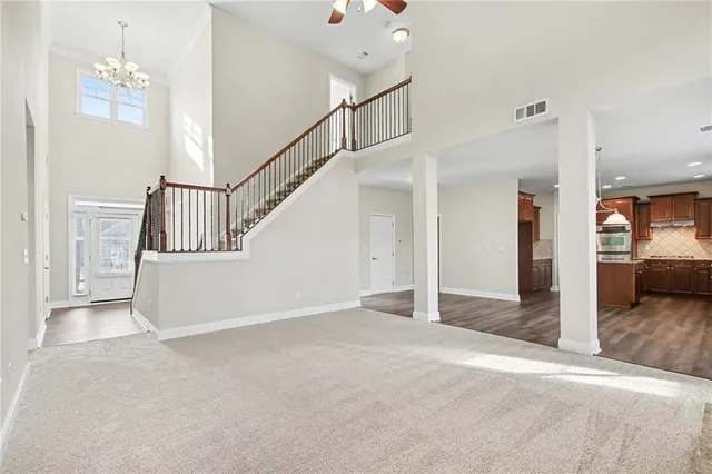 a view of a hallway view with staircase