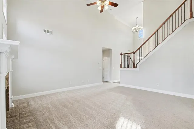 a view of an empty room with stairs