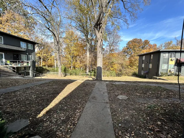 a front view of a house with outdoor seating