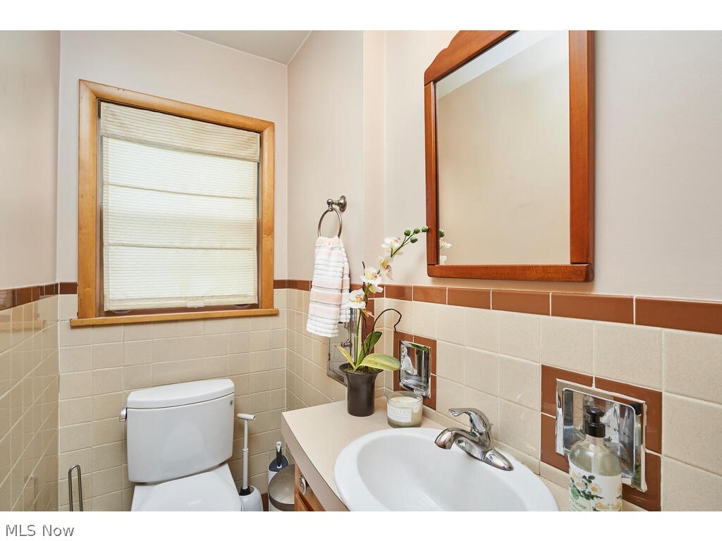 2438 Ridgewood Road Akron, OH 44313 - Photo 10 of 18 First floor powder room with original tile and built-in soap holders. Adorable!