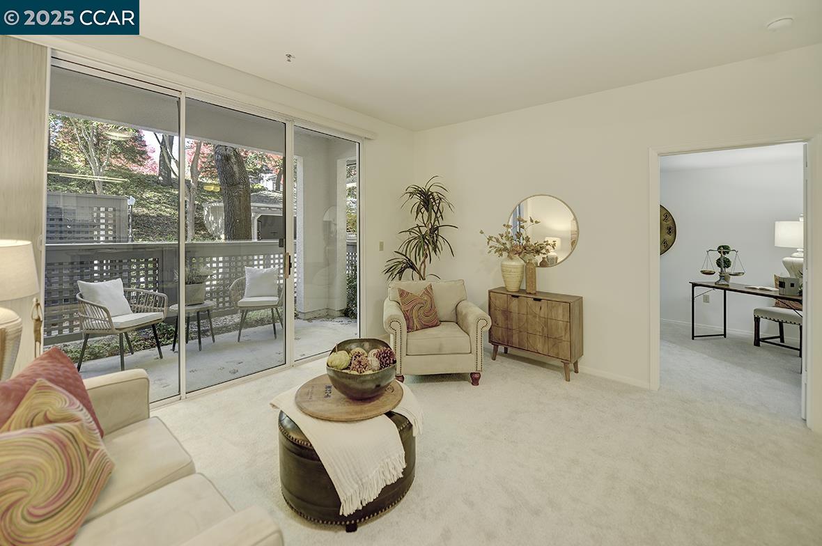 1840 Tice Creek Drive, Unit 2110 Walnut Creek, CA 94595 - Photo 25 of 43 a living room with furniture a couch and large window