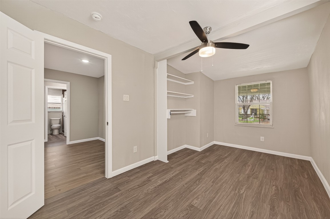 10141 Chadwick Street Houston, TX 77029 - Photo 14 of 25 wooden floor in an empty room with a window