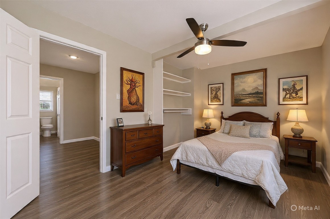 10141 Chadwick Street Houston, TX 77029 - Photo 15 of 25 a bedroom with a large bed and a ceiling fan