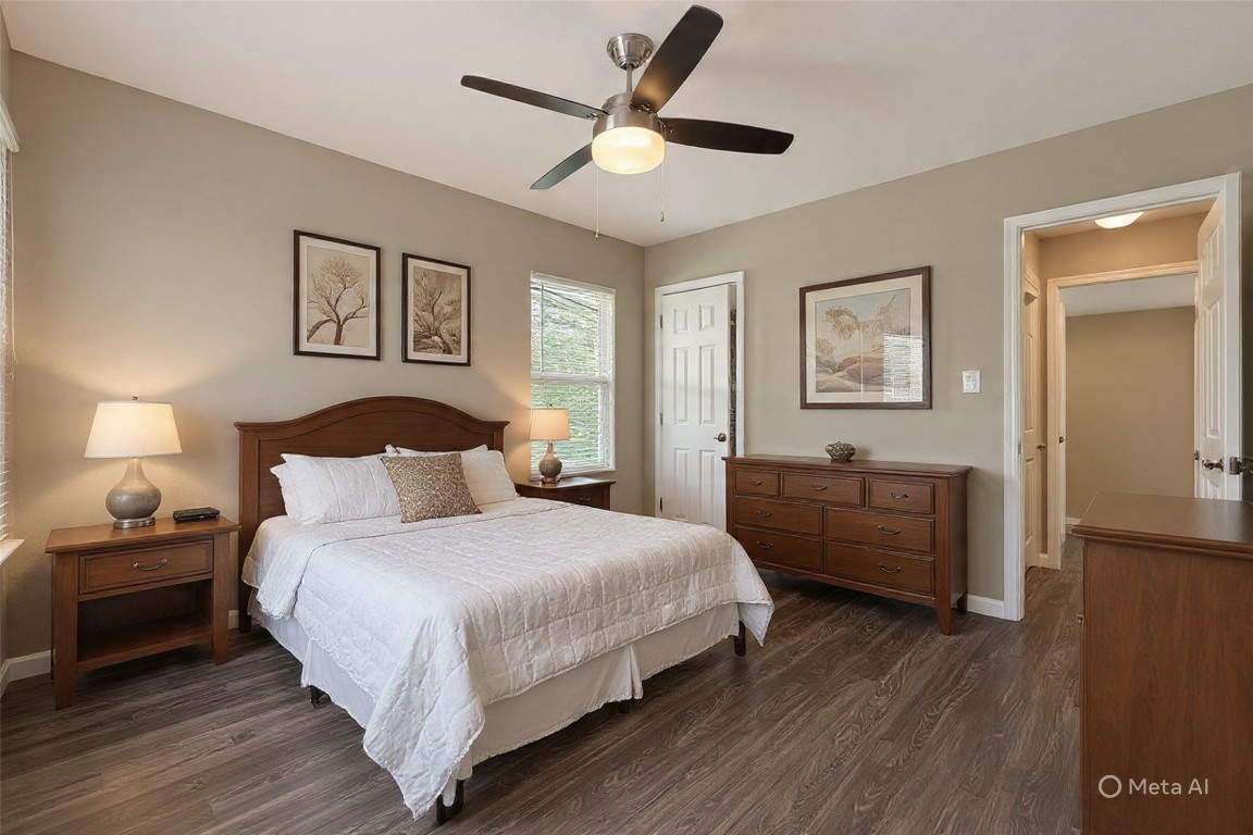 10141 Chadwick Street Houston, TX 77029 - Photo 16 of 25 a bedroom with a bed and a chandelier
