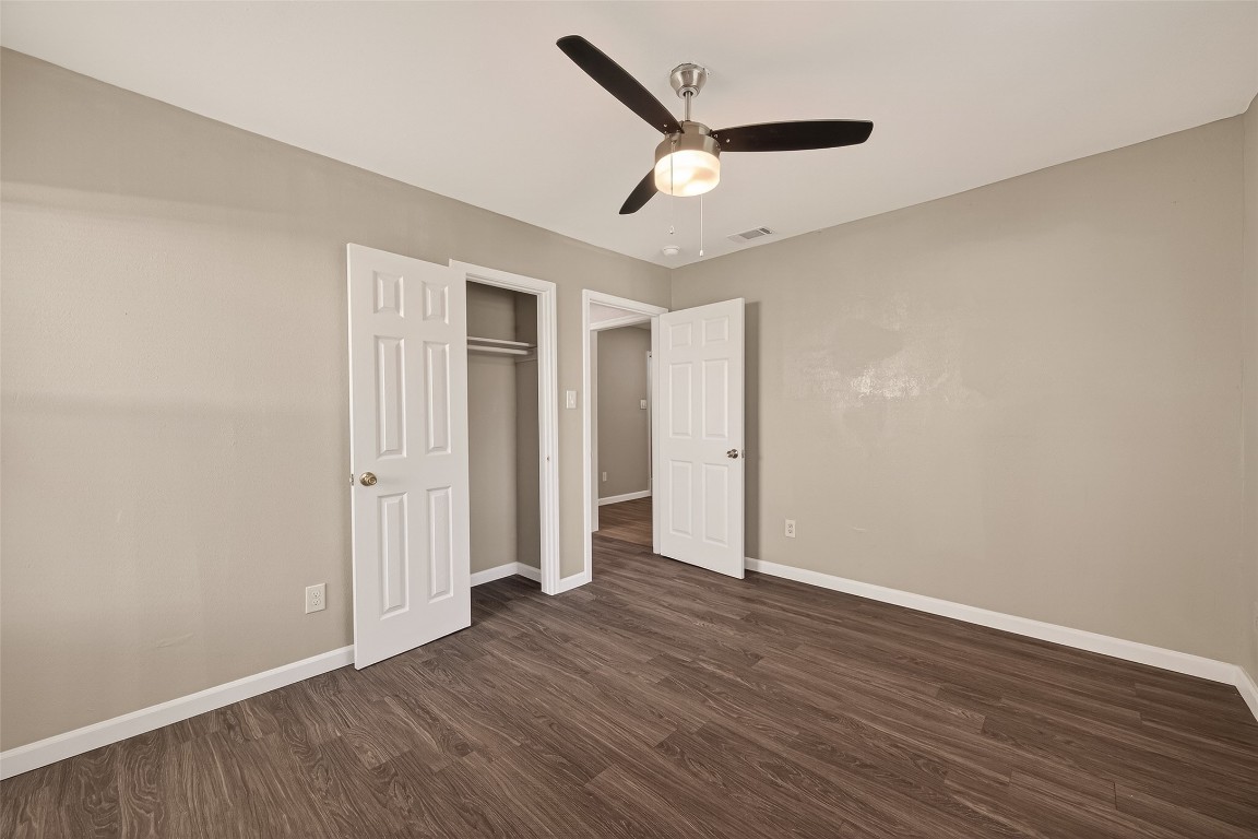 10141 Chadwick Street Houston, TX 77029 - Photo 17 of 25 an empty room with wooden floor and windows