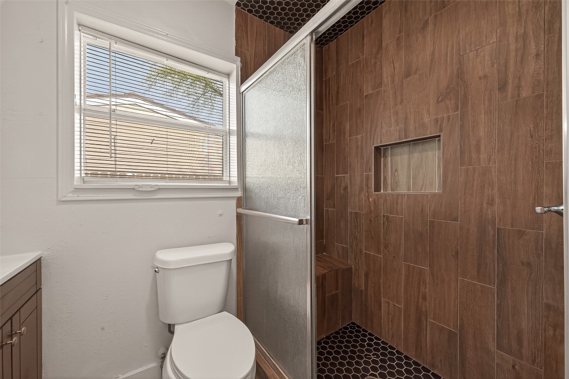 10141 Chadwick Street Houston, TX 77029 - Photo 18 of 25 a bathroom with a toilet a sink and a shower