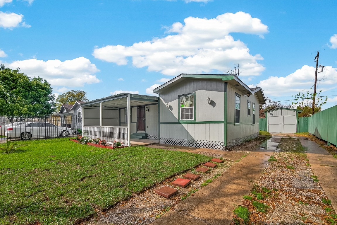 10141 Chadwick Street Houston, TX 77029 - Photo 3 of 25 a front view of a house with a yard