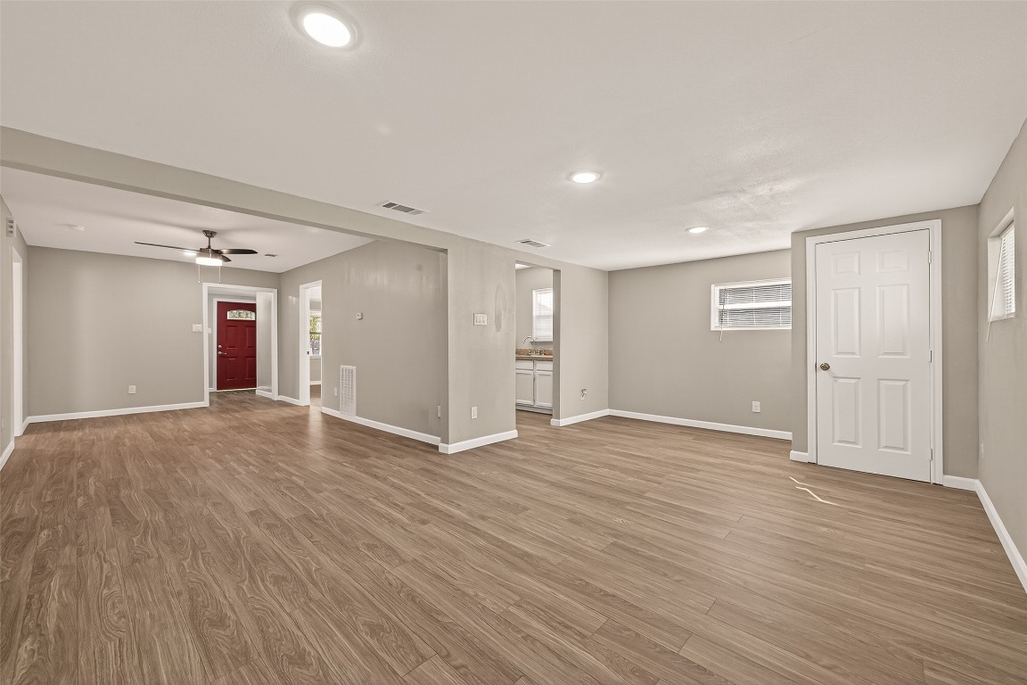 10141 Chadwick Street Houston, TX 77029 - Photo 6 of 25 a view of an empty room with wooden floor