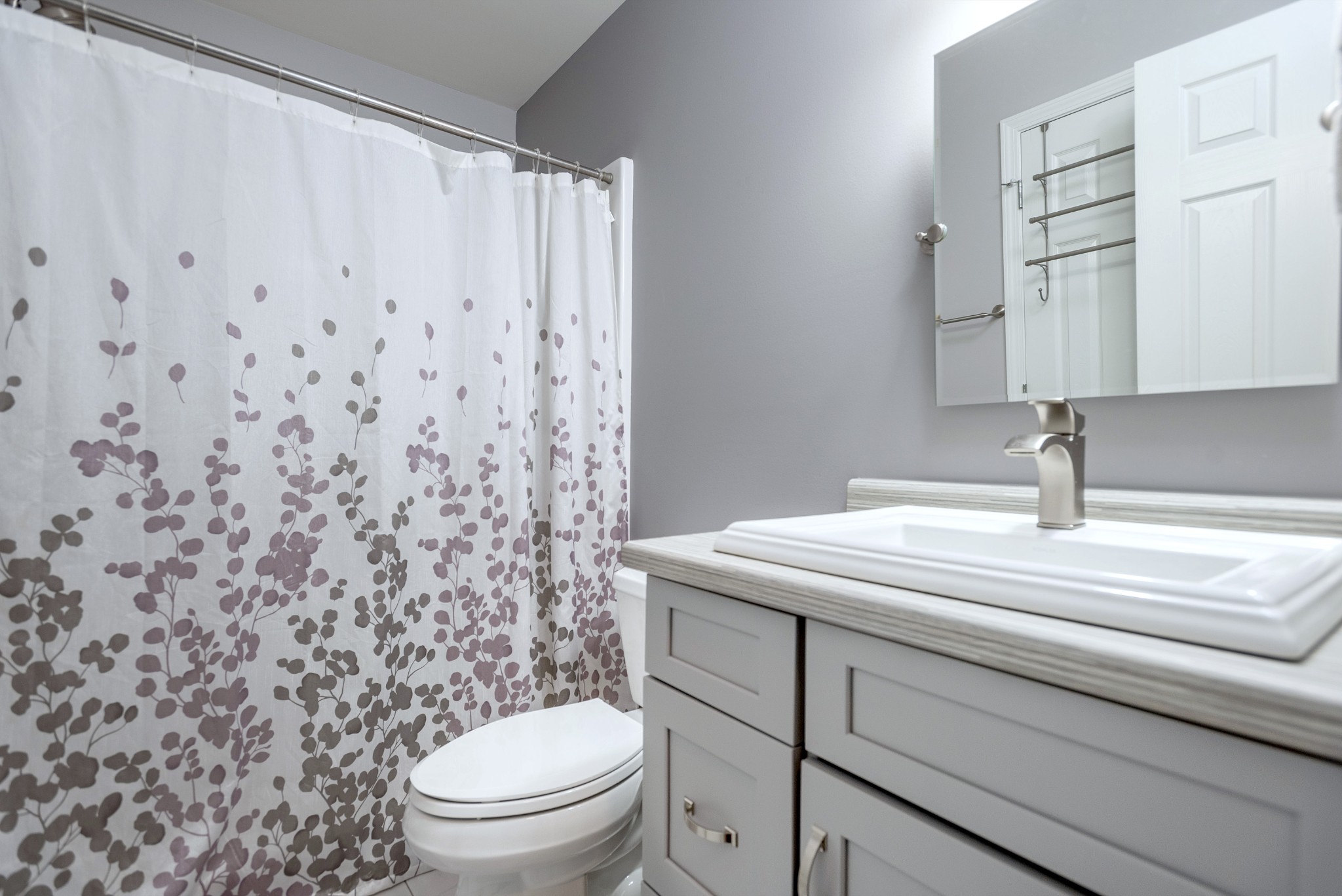 601 Keysburg Road Adams, TN 37010 - Photo 13 of 21 a bathroom with a granite countertop sink a toilet and a mirror