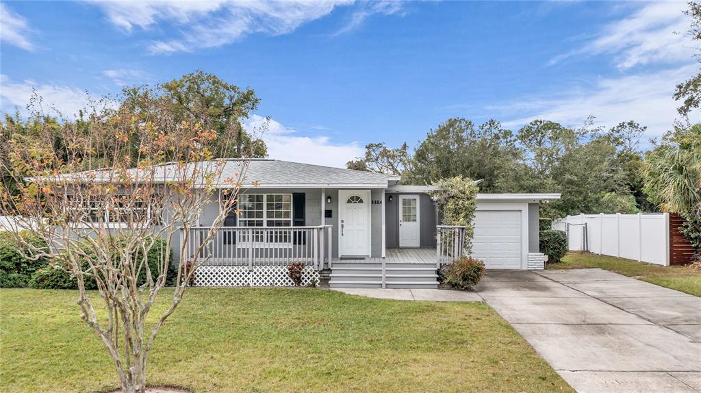 1124 Edgewater Court Orlando, FL 32804 - Photo 1 of 22 a house with trees in front of it