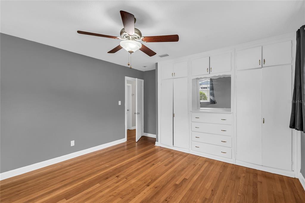 1124 Edgewater Court Orlando, FL 32804 - Photo 15 of 22 wooden floor in an empty room with a window