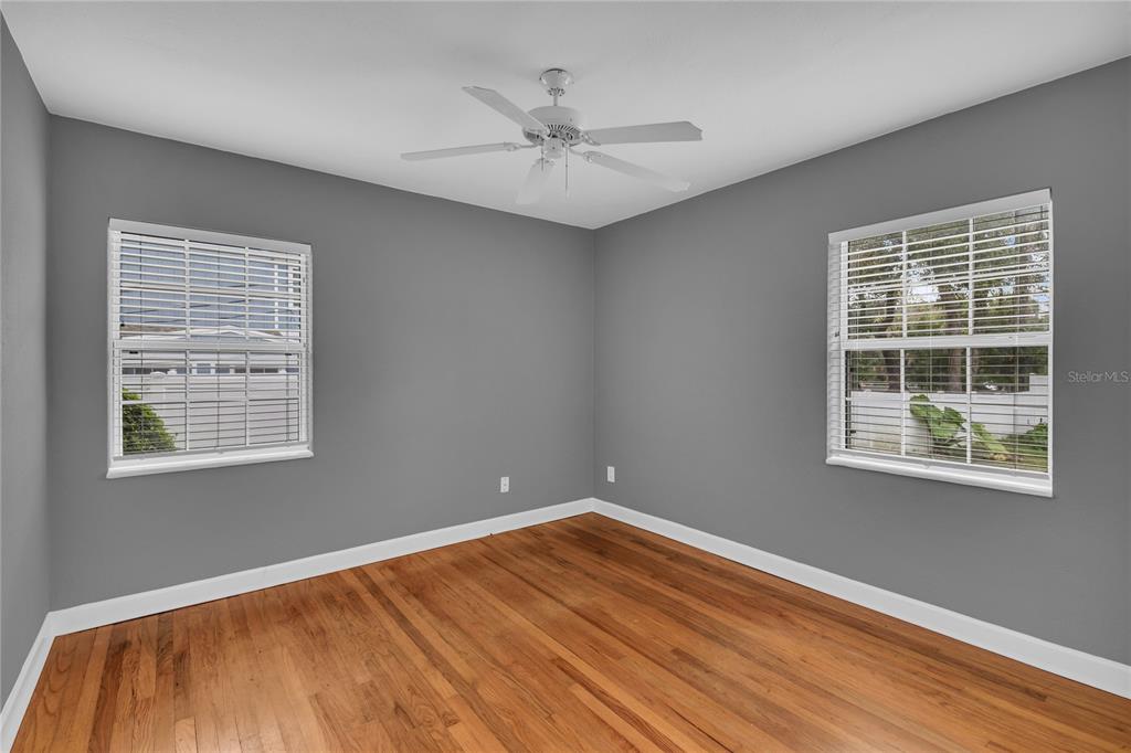 1124 Edgewater Court Orlando, FL 32804 - Photo 16 of 22 a view of a room with wooden floor and a window
