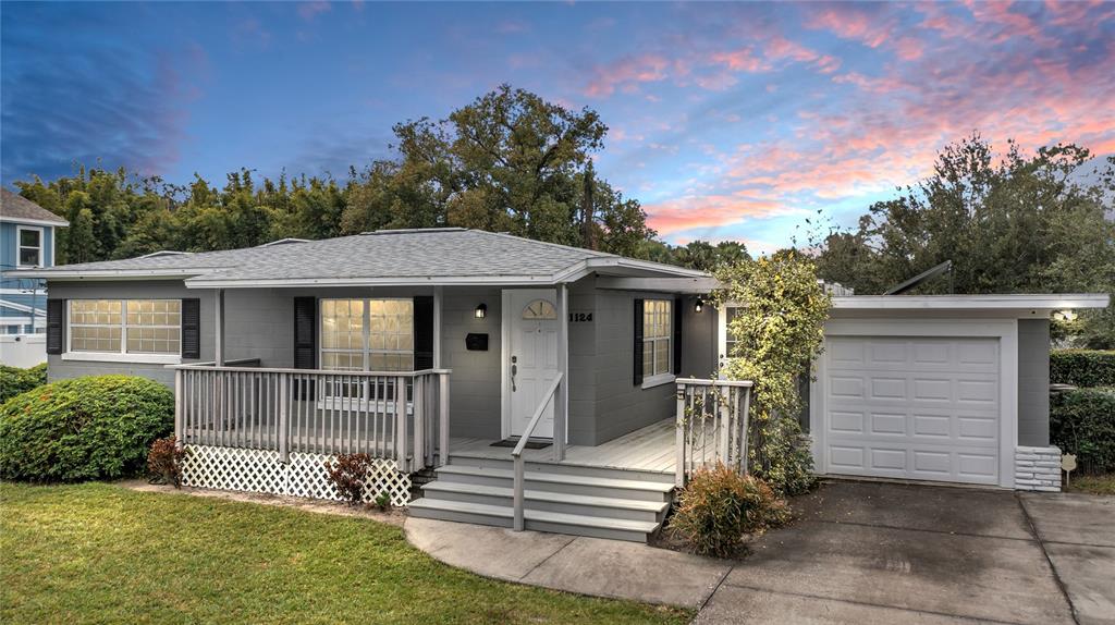 1124 Edgewater Court Orlando, FL 32804 - Photo 18 of 22 a front view of a house with a garden