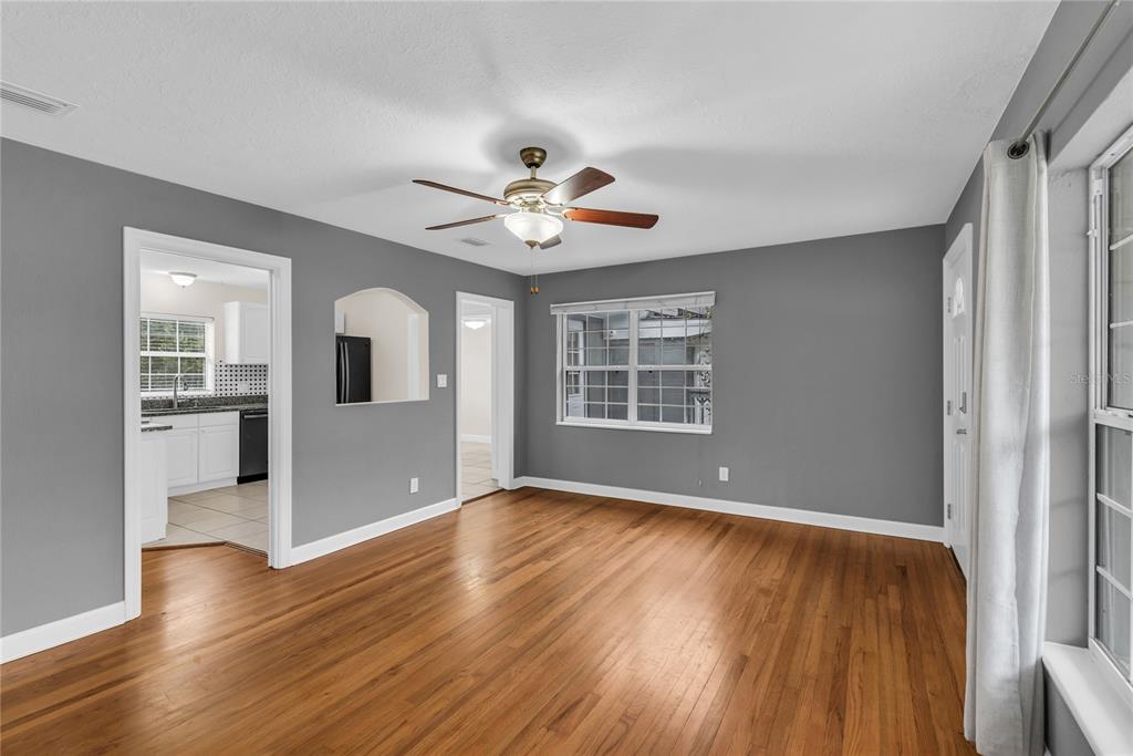 1124 Edgewater Court Orlando, FL 32804 - Photo 6 of 22 wooden floor in an empty room with a window