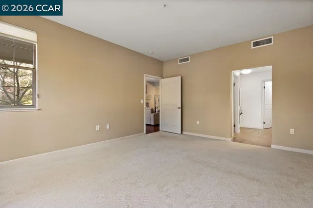a bathroom with a shower and a window