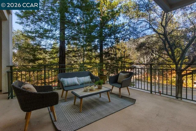 an aerial view of a house with a garden and lake view