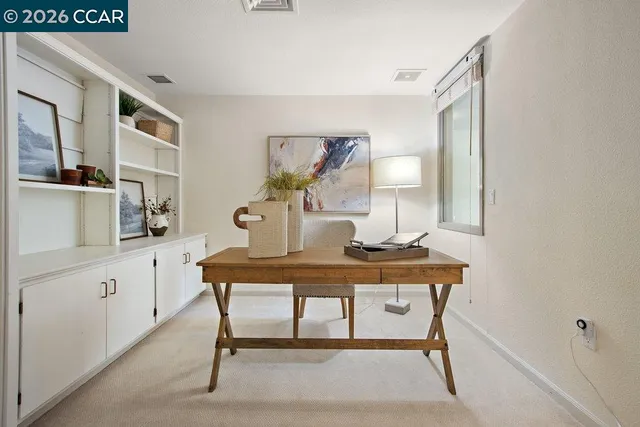 a kitchen with granite countertop stainless steel appliances and refrigerator