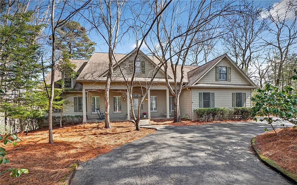 1027 Hunters Trace Jasper, GA 30143 - Photo 1 of 70 a front view of a house with a yard