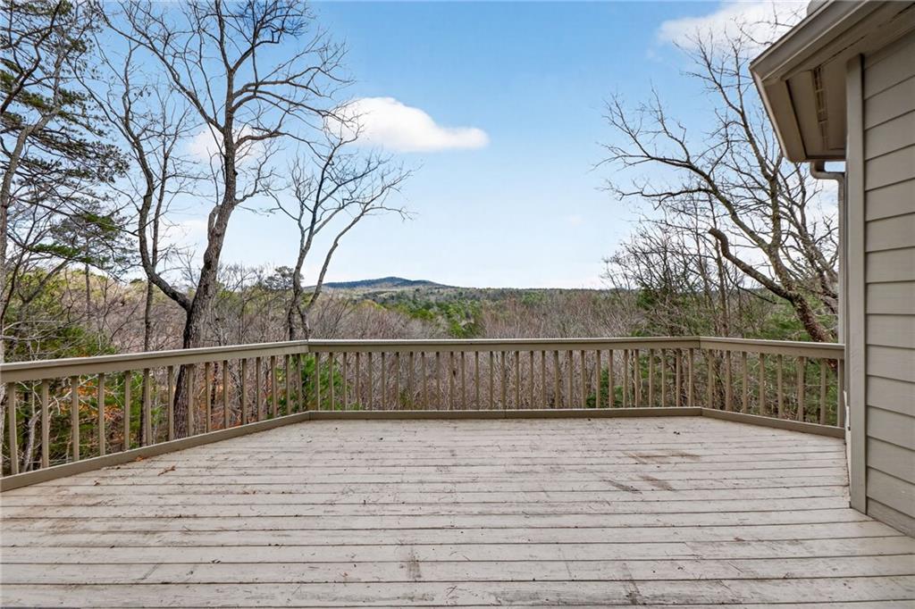 1027 Hunters Trace Jasper, GA 30143 - Photo 25 of 70 a view of balcony with wooden floor and fence