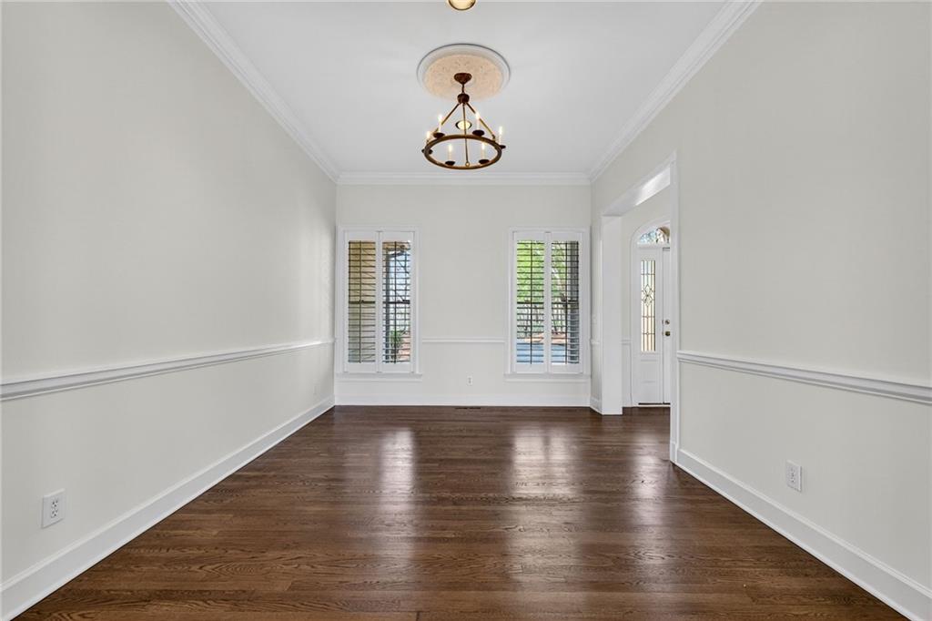1027 Hunters Trace Jasper, GA 30143 - Photo 26 of 70 a view of empty room with wooden floor and fan