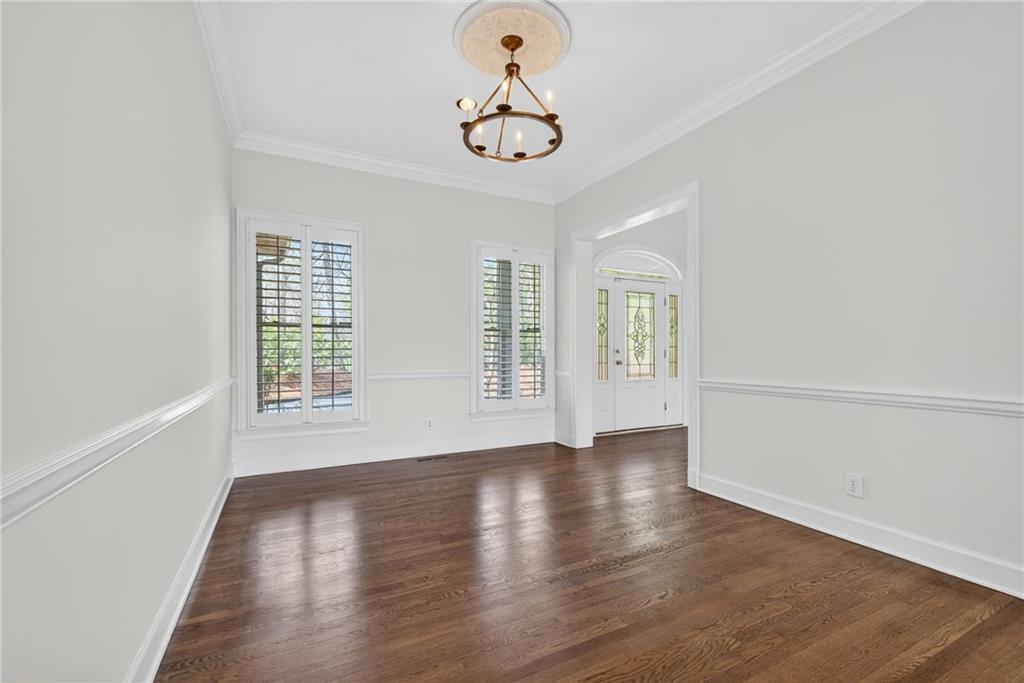 1027 Hunters Trace Jasper, GA 30143 - Photo 27 of 70 a view of an empty room with wooden floor and a window