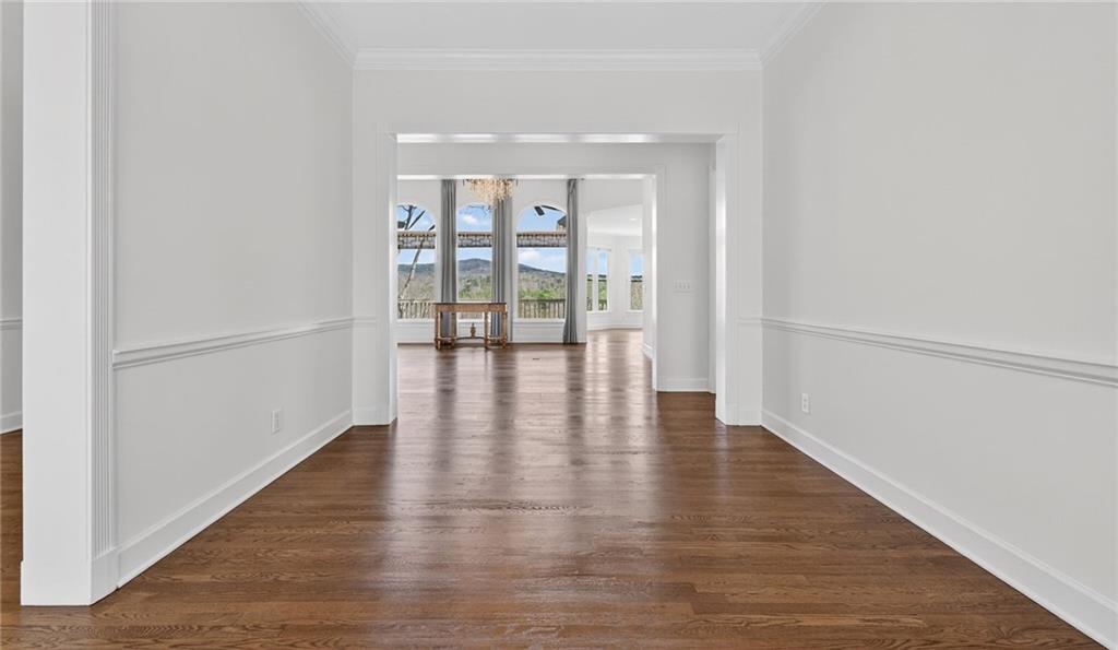 1027 Hunters Trace Jasper, GA 30143 - Photo 28 of 70 a view of an empty room with wooden floor and a window