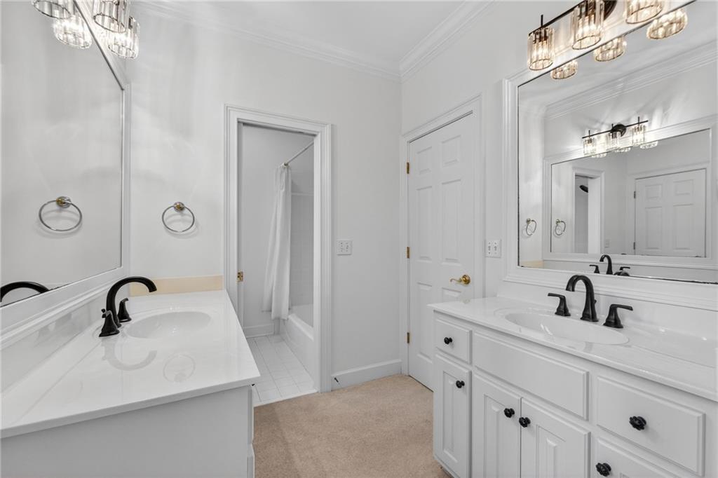 1027 Hunters Trace Jasper, GA 30143 - Photo 45 of 70 a bathroom with double sink and mirror