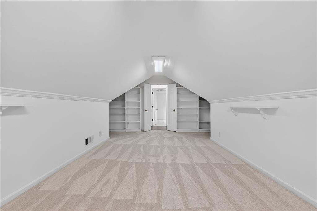 1027 Hunters Trace Jasper, GA 30143 - Photo 48 of 70 a view of an empty room with wooden floor and windows