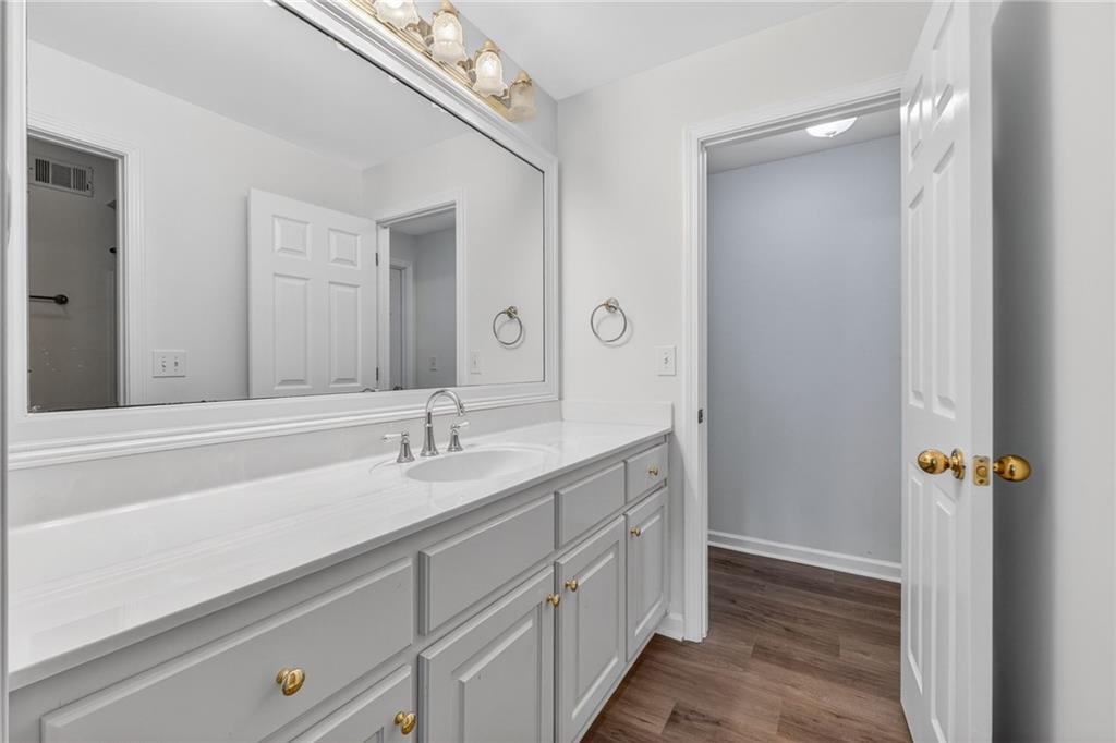 1027 Hunters Trace Jasper, GA 30143 - Photo 61 of 70 a bathroom with a sink and a mirror