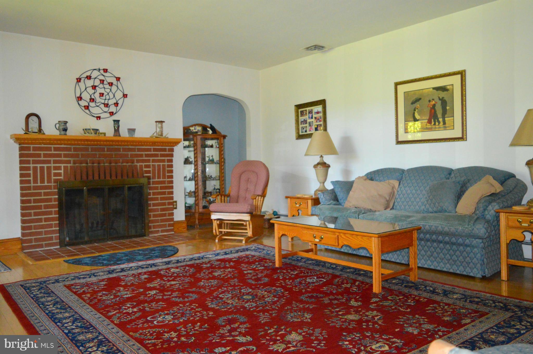 1611 South Rolling Road Baltimore, MD 21227 - Photo 14 of 30 Living Room W/FIREPLACE AND HARDWOOD