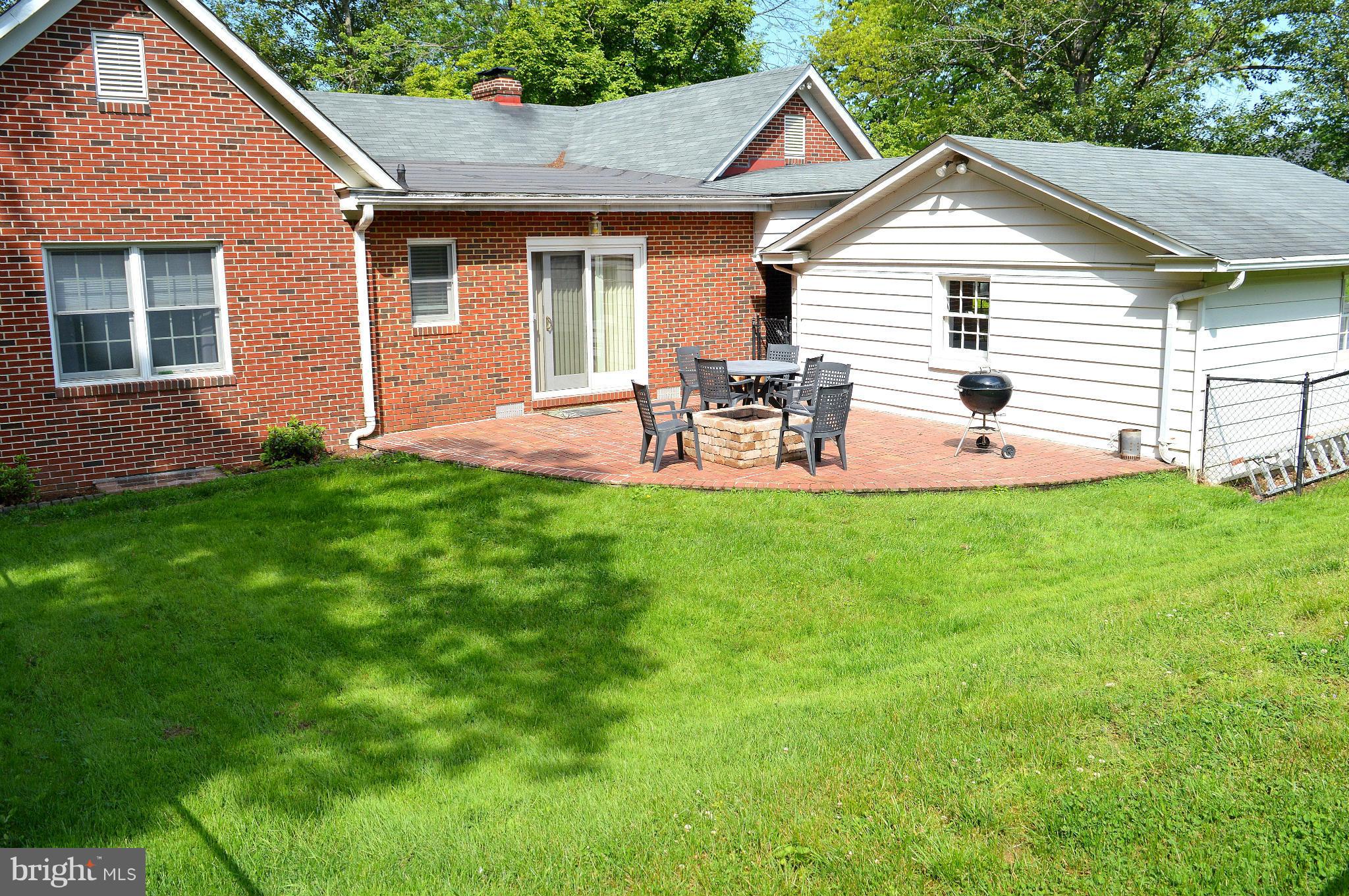 1611 South Rolling Road Baltimore, MD 21227 - Photo 3 of 30 FENCED IN PAVER PATIO W/FIREPIT