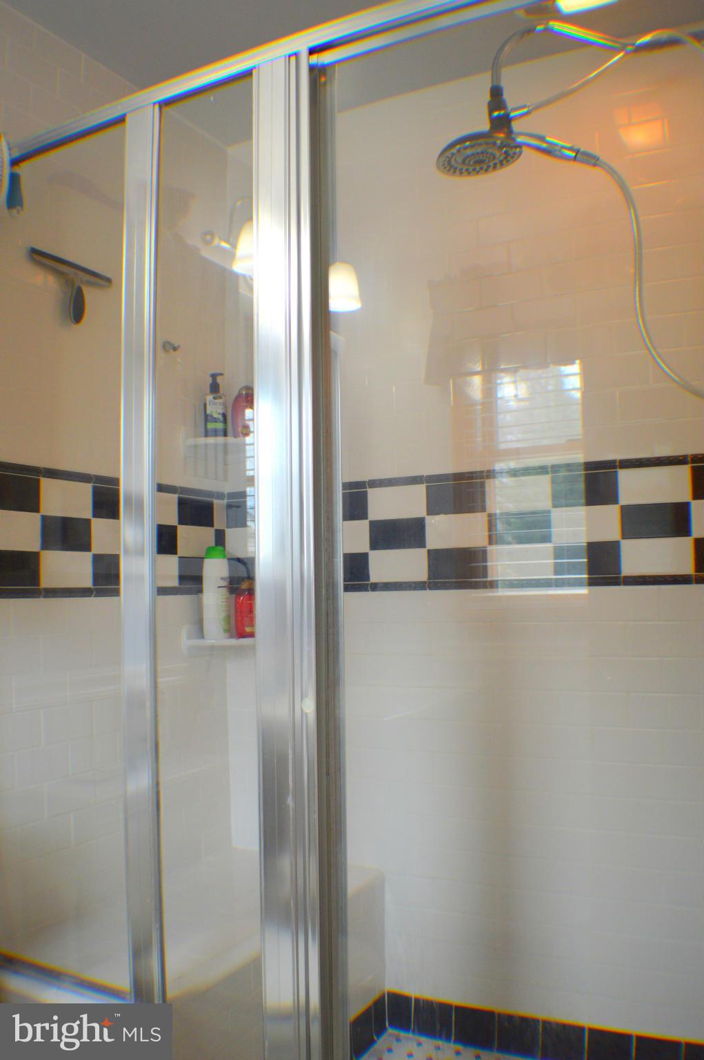 1611 South Rolling Road Baltimore, MD 21227 - Photo 9 of 30 MASTER SHOWER WITH BENCH
