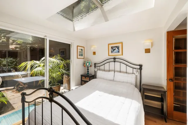 a bedroom with furniture and a bed