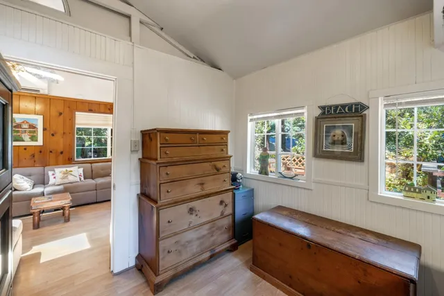a living room with furniture and large windows