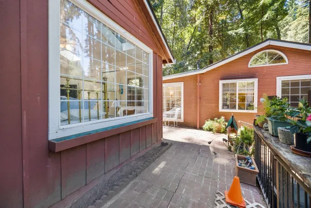 a balcony with wooden floor and furniture