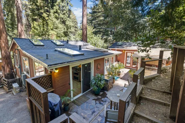 a view of an house with backyard wooden floor and outdoor seating
